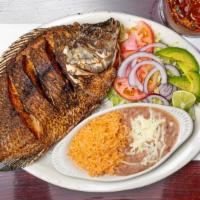 43. Mojarra Frita · Fried tilapia fish seasoned with lime and garlic.
