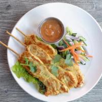 Chicken Satay · Grilled Yellow Curry Marinated Chicken Breast Skewer Served with Peanut Sauce and Cucumber S...