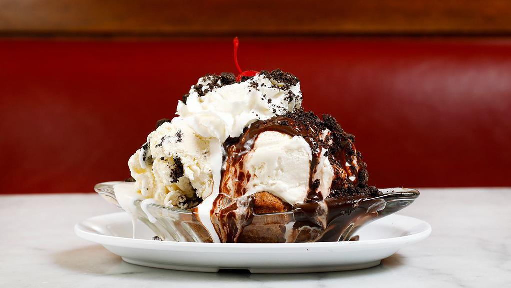 THE COOKIE CONNECTION · Crazy for Cookies? Picture this - A cookie creation that starts with a warm chocolate chip cookie under scoops of Cookies n' Cream and Cookie Dough ice cream topped with hot fudge, marshmallow topping, whipped cream, crushed Oreos and a cherry.