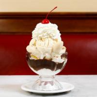 FUDGEANNA · Our handmade hot fudge sauce and a whole. banana layered in between two generous. scoops of ...