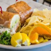 CRAB MELT · Our famous crab salad served with lettuce and tomato on a French roll and topped with melted...