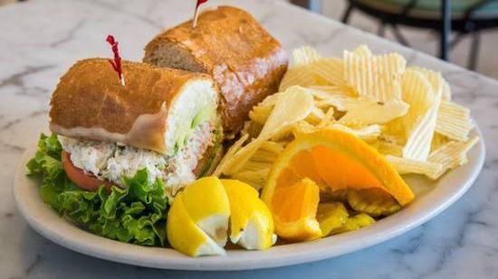 CRAB MELT · Our famous crab salad served with lettuce and tomato on a French roll and topped with melted Monterey jack cheese and ripe avocado.