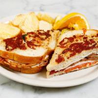TURKEY BACON MELT · A mouthwatering Melt! Grilled sourdough. parmesan cheese bread with melted Swiss. cheese, tu...