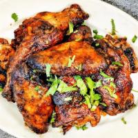 BBQ Wings · Marinated for 24 hours then roasted to perfection in our brick ovens. Specify mild, spicy, o...