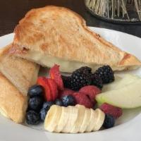 Grilled Cheese · Multigrain bread, mozzarella cheese served with seasonal fruit or garlic fries