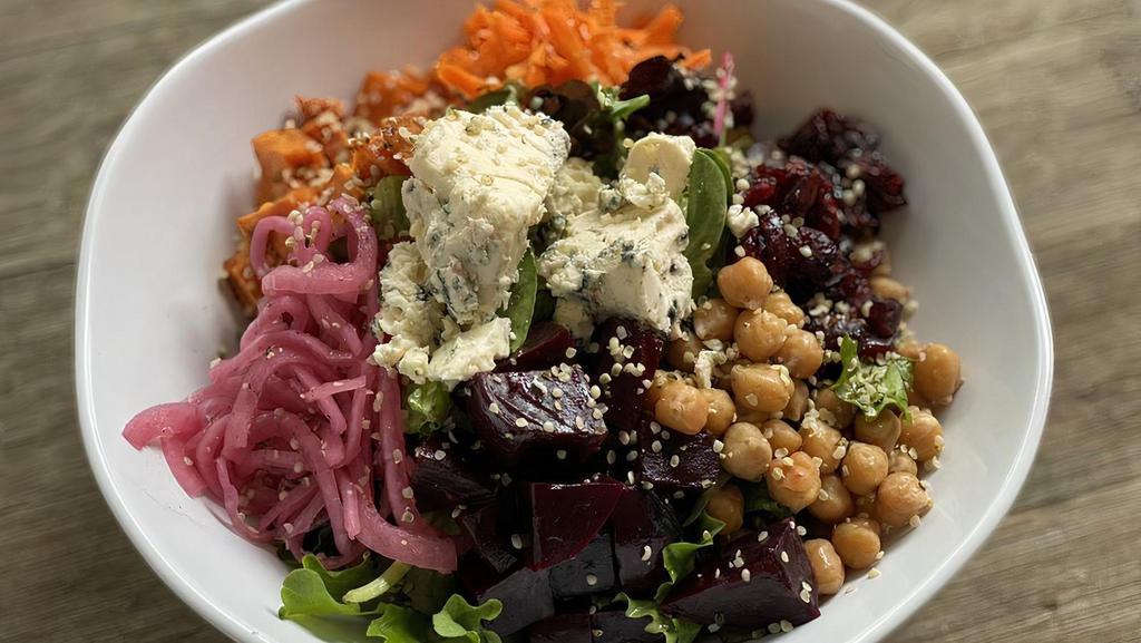 Beets · Mix greens, beets, pickles onions, baked sweet potato, carrots, dry cranberries, blue cheese, hemp & passion-vinaigrette.