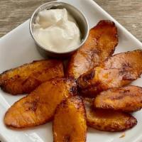 Side of Sweet Plantains · With a side a sour cream.