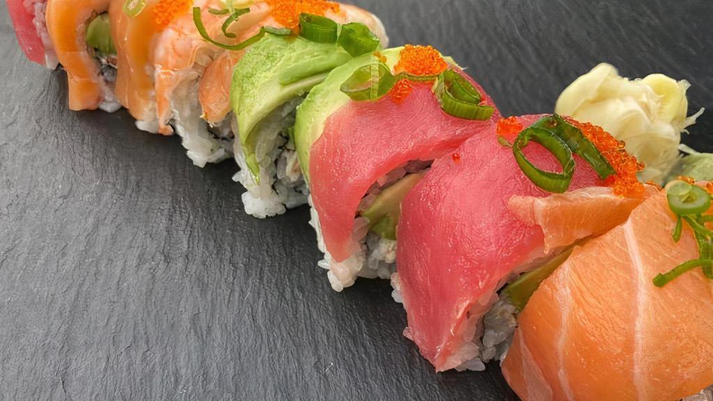 Rainbow Roll · Imitation Crab Meat and Avocado topped with Salmon, Tuna, Ebi
