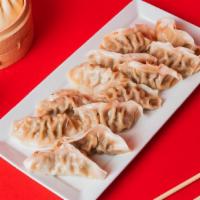 12 Pack Dumplings  · Steamed with your choice of Green Vegetable or Ginger Chicken.