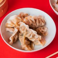 8 Pack Dumplings · Steamed with your choice of Green Vegetable or Ginger Chicken.