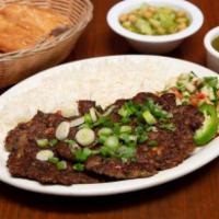 Chaplee Kabob · Grilled ground sirloin patties mixed with green onions, crushed chili peppers, and house sea...