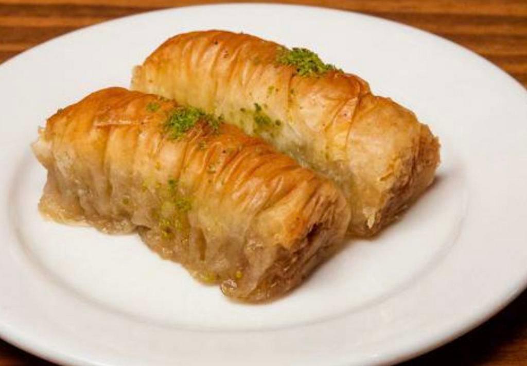 Baklava · Freshly baked layers of filo pastry filled with chopped nuts, and sweetened with syrup.