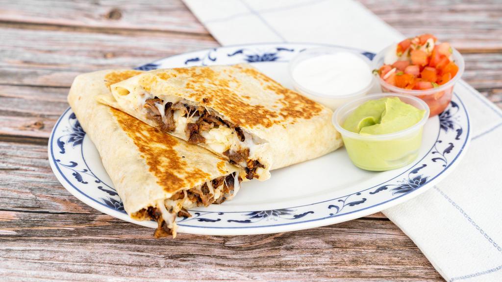 Quesadilla · Flour tortilla filled with cheese. Served with sour cream, guacamole and fresh salsa.