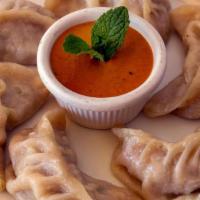 1. Steamed Dumplings/ Himalayan Momo · Your choice of chicken, pork or vegetable dumplings. Six momos wrapped in flour dough and st...