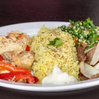 Combo Plate · Chicken & lamb, with yellow basmati rice, hummus, mediterranean salad, pita, and yogurt sauce.