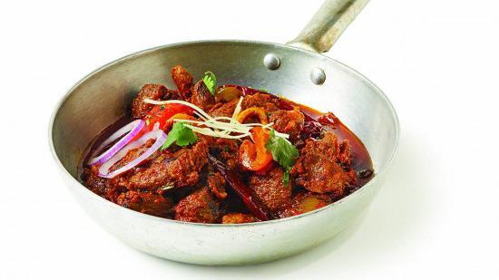 Karahi Lamb · Ginger, garlic and onions simmered with fresh tomatoes and spices to flavor