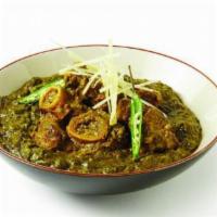 Lamb Saag · Spiced spinach sauce tenderizes and flavors the lamb