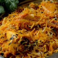 Biryani · Basmati rice cooked with onions, tomatoes and indian spices with your choice of