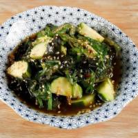 Cucumber Seaweed Salad · Cucumbers + seaweed salad with sesame soy dressing.
