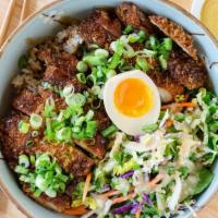 Chicken Katsu Donburi · Chicken Katsu rice bowl, salad with miso dressing, katsu sauce, green onion and half an egg.
