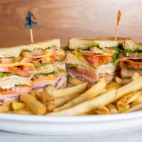Triple Deck Club · Turkey, ham, bacon, cheddar, lettuce, tomato and mayonnaise on your choice of sliced toast.
