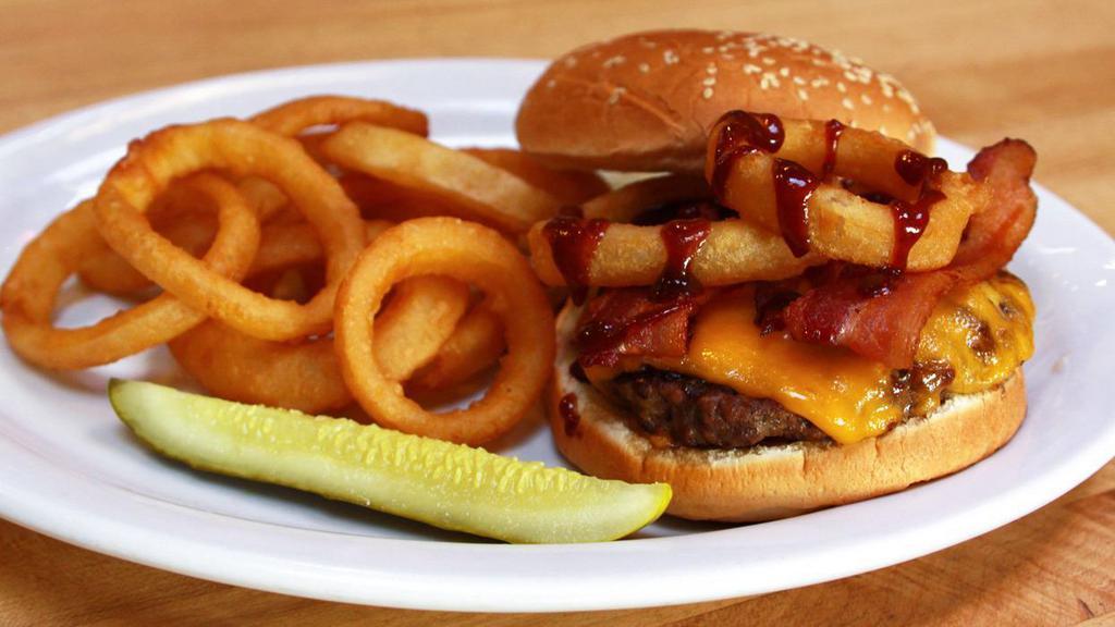 BBQ Bacon Burger · Beef burger topped with bacon, zesty BBQ sauce, onion rings, and cheddar.