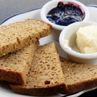 Gluten-Free Quinoa Bread · Toasted with honey butter and seasonal preserves.