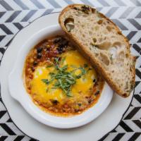 Spicy Baked Eggs · two eggs, spicy tomato and black bean stew, cheddar cheese, cilantro, toast

*Not available ...