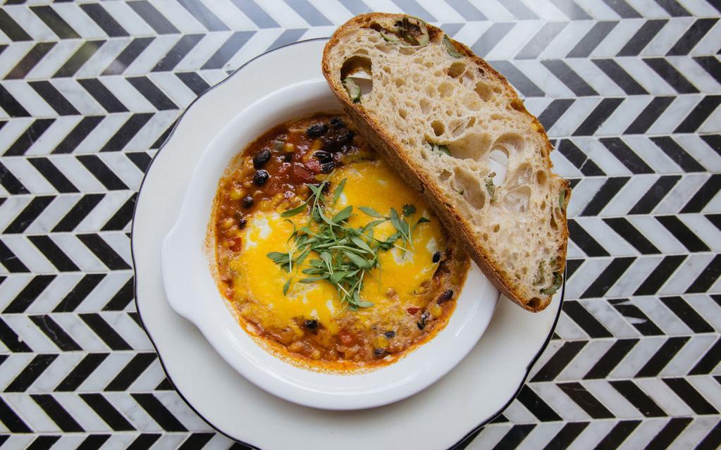Spicy Baked Eggs · two eggs, spicy tomato and black bean stew, cheddar cheese, cilantro, toast

*Not available in Dispatch Goods Reusable Containers