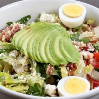 Cobb · Romaine lettuce, roasted chicken, tomato, bacon, blue cheese, and hard-boiled egg with house...