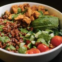 Peruvian Chicken Rice Bowl · red rice, spiced chicken breast, cucumber, avocado, cherry tomatoes, and romaine with herb d...