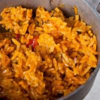 Arroz Amarillo · Spanish rice with smoked ham,. green olives, sweet peppers and. spices.