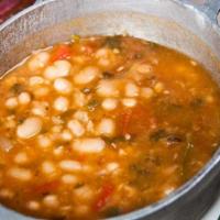 Habichuelas Blancas · Braised white beans with. carrots, green olives, potatoes,. pumpkin and sweet peppers.