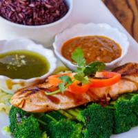Grilled Salmon · Grilled marinated salmon with Thai spices & herbs served with Thai hot sauce, peanut sauce, ...