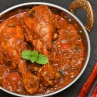 Authentic Chicken Vindaloo · Crispy marinated chicken cooked in a highly flavorful spicy mixture and vinegar.