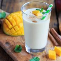 In House Special Mango Lassi · Delicious blend of mangoes and yogurt with a touch of cardamom.