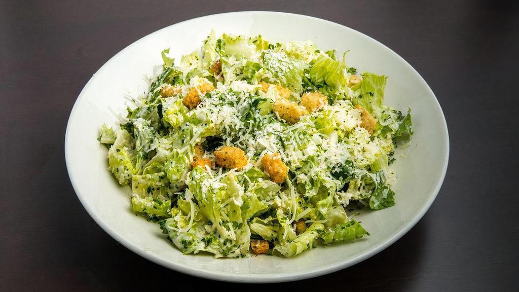 Caesar Salad · Romaine lettuce tossed with Caesar dressing, shredded Romano cheese, and croutons.