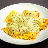 Gourmet Jumbo Crab Ravioli · Large ravioli stuffed with savory crab meat and ricotta cheese topped with a rich Pesto Alfr...