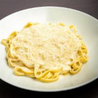 Fettuccine Alfredo · Fettuccine noodles in a butter cream sauce with shredded Romano cheese.