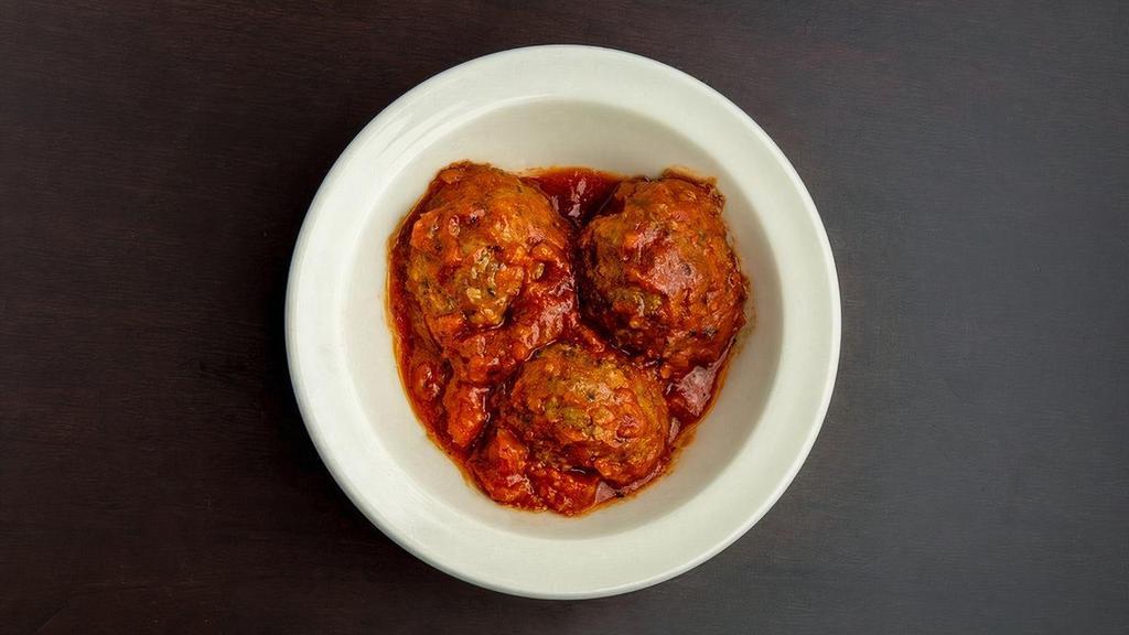 Three Meatballs · Three generously portioned handmade beef meatballs, delicately seasoned with a blend of herbs and spices.