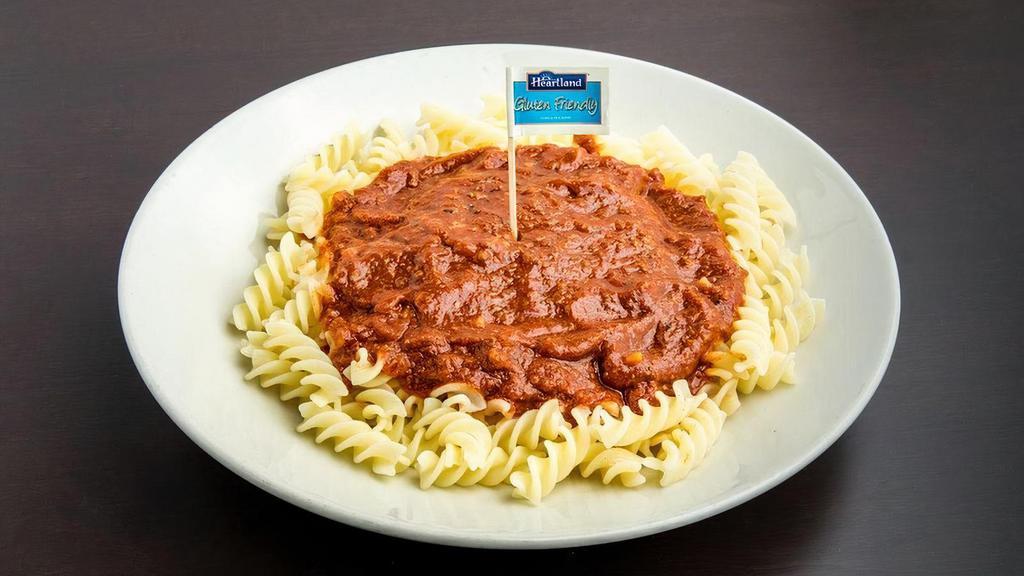 Rich Meat Sauce · Mamma Mia! Our 1969 original from scratch recipe of perfectly ripe tomatoes and ground beef sautéed with freshly chopped onions, celery and garlic, all simmered slowly to perfection with savory Italian herbs and spices and served over gluten friendly fusilli pasta and cooked to perfection. Delizioso!