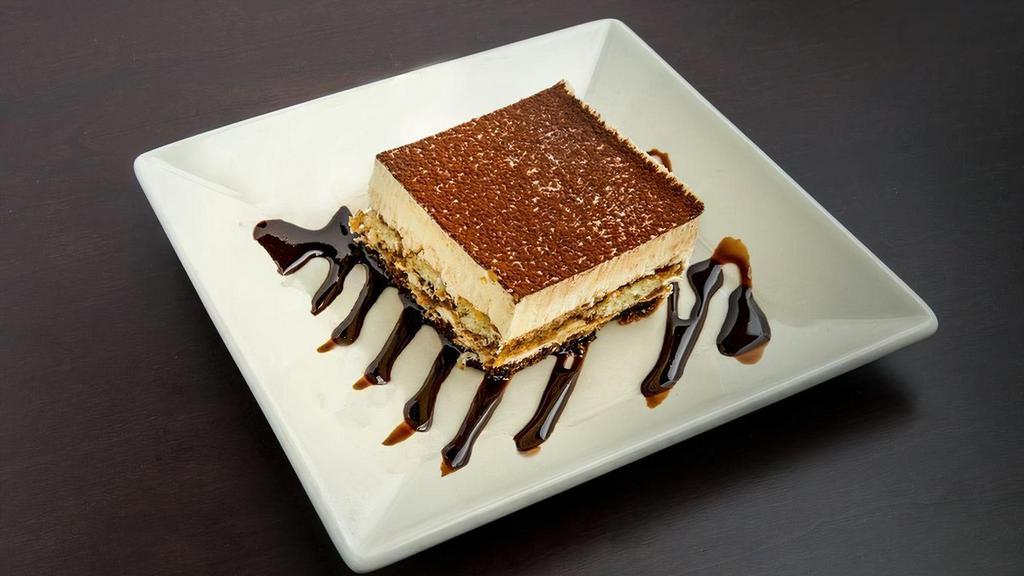 Tiramisu · Savory layers of mascarpone cream on pillows of espresso soaked lady fingers, finished with a delightful dusting of cocoa..