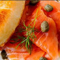 Lox Bagel · toasted bagel with smoked salmon, cucumber, tomato, onion, caper, and cream cheese or scalli...