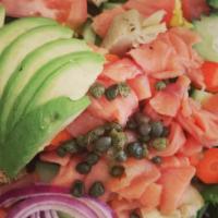 Salmon Salad · Spring mix, artichoke hearts, avocado, onion, tomato caper, and smoked salmon.
