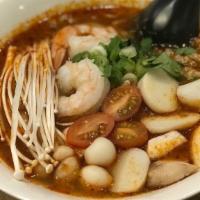 Tom Yum Noodle Soup · Sour and spicy soup with small rice noodle, shrimp, ground pork, fish ball, bean sprout, and...
