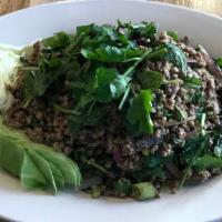 Larb Pork · ground pork, roasted rice powder, mint leaves, green and red onions in spicy lime dressing