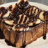 Thick Toast - Nutella Banana · Buttered thick toast topped with nutella and banana