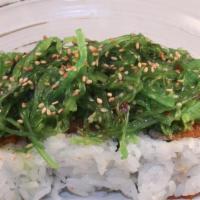 Poki · Spicy level 1. Spicy tuna roll topped w/ seaweed salad.

Consuming raw or undercooked meats,...