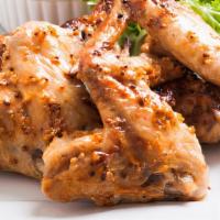 Honey Mustard Fried Chicken Wings · Golden-crispy fried chicken wings dipped in sweet honey mustard sauce.