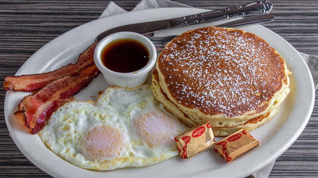 2X2X2 · Two pancakes, two eggs any style, and your choice of bacon or chicken apple sausage.